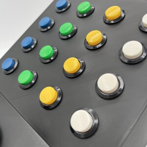 Close up shot of the push buttons on the top half of the panel.