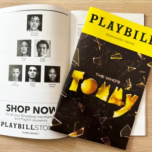 May include: A Playbill for the musical "The Who's Tommy" at the Nederlander Theatre. The cover features a yellow and black design with broken glass and the title of the show.
