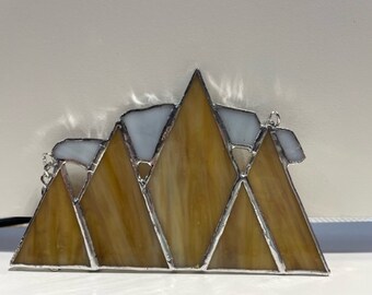 Stained Glass Mountain Scene with Clouds or Sun