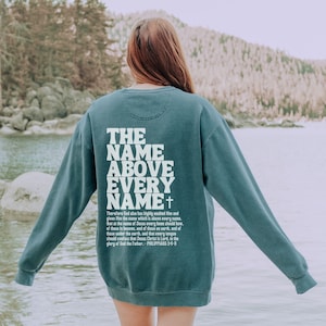 Christian Comfort Colors Sweatshirt, The Name Above Every Name Jesus Back Print Sweatshirt, Bible Verse Sweatshirt, Scripture Sweatshirt