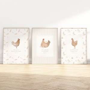 May include: Three framed watercolor prints featuring chickens. Each print has a different chicken illustration with text below. The frames have different patterns: feathers, stripes, and floral. The prints are displayed on a wooden surface.