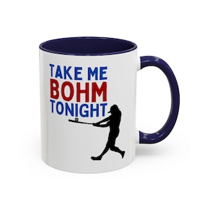 May include: White ceramic mug with a navy blue interior and handle. The mug features the text "TAKE ME BOHM TONIGHT" in blue and red, along with a black silhouette of a baseball player swinging a bat.