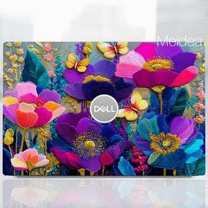 May include: A laptop skin featuring a vibrant floral design with embroidered-style details. The design includes large, colorful flowers in shades of purple, pink, and blue, with yellow butterflies and a Dell logo. The background is a soft, muted teal.