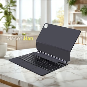 May include: A dark gray tablet keyboard case with a built-in keyboard and trackpad. The case is open, revealing the keyboard and the tablet screen. The brand name "Meidea.Han" is printed on the left side of the image. The case is on a marble countertop.
