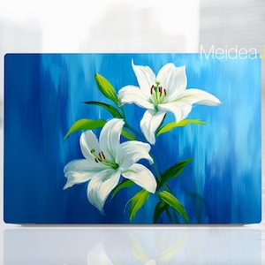 May include: A painting of white lilies on a blue background. The lilies are in bloom and have green leaves. The background is a light blue with darker blue brushstrokes.