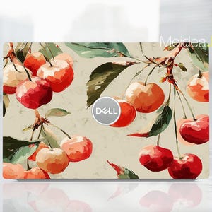 May include: Laptop skin featuring a watercolor design of cherries on branches with green leaves. The cherries are red and orange, set against a beige background. The Dell logo is visible. The text "Moidea Han" is in the upper right corner.