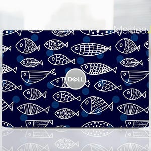 May include: A navy blue laptop skin featuring a repeating pattern of white, stylized fish and blue polka dots. The Dell logo is centered. The design is a whimsical, aquatic theme.