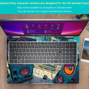 May include: Laptop with a keyboard overlay and a colourful design. The keyboard has a standard layout. The screen displays a colourful interface. A smartphone and a watch are also visible.