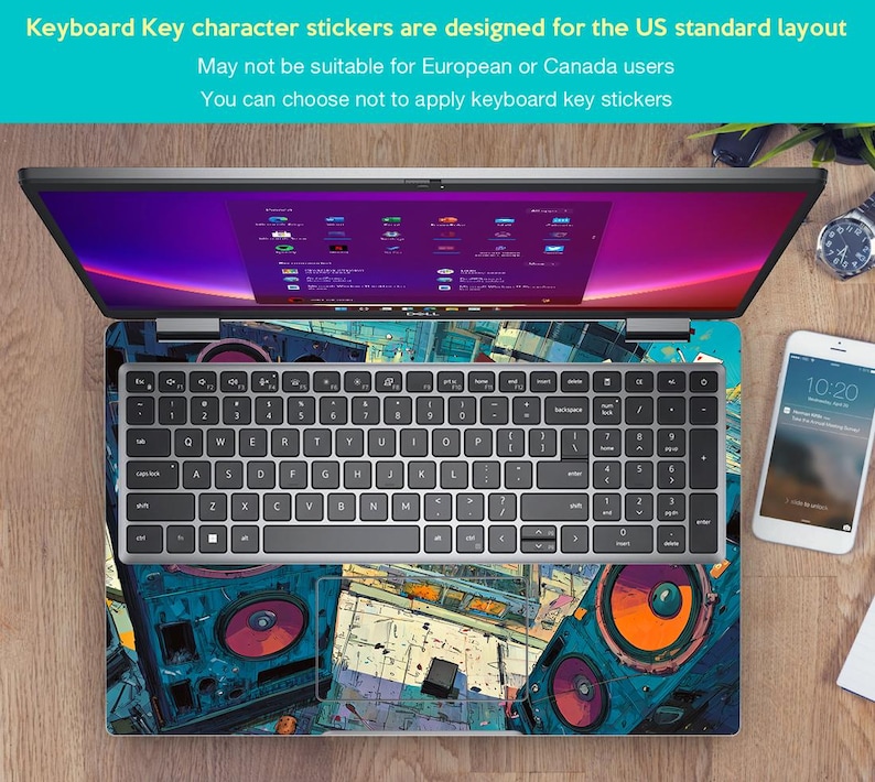 May include: Laptop with a keyboard overlay and a colourful design. The keyboard has a standard layout. The screen displays a colourful interface. A smartphone and a watch are also visible.