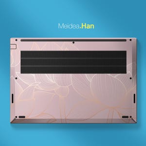May include: A pink laptop base with a floral design in gold. The laptop has a black vent and the text "Meidea.Han" in yellow.