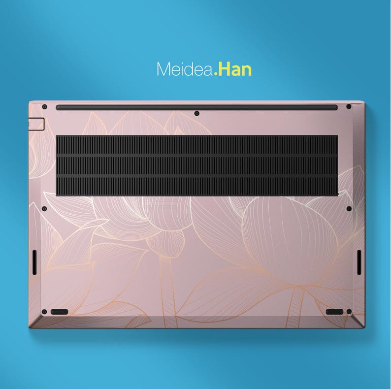 May include: A pink laptop base with a floral design in gold. The laptop has a black vent and the text "Meidea.Han" in yellow.