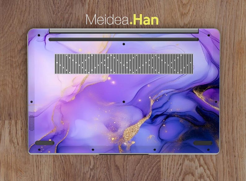 May include: Purple and gold laptop skin with a marbled design. The skin has a subtle shimmer and a modern abstract look.