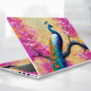 May include: Laptop with a vibrant peacock design. The cover features a colorful peacock perched on a branch with pink blossoms against a textured yellow and orange background. The text "Meidea.Han" is visible on the laptop.