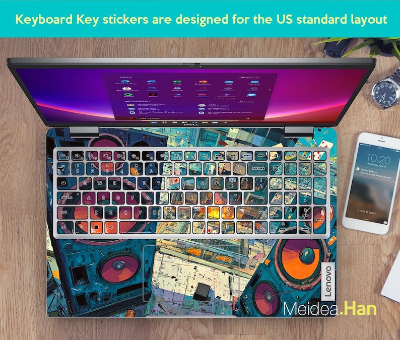 May include: Laptop with a keyboard overlay featuring a colourful, artistic design. The keyboard keys are covered with stickers. The laptop is open, displaying a screen with a purple and pink gradient. A smartphone and watch are visible.