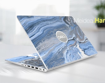 May include: A laptop computer with a blue and grey marbled design on the lid. The Dell logo is visible on the lid.