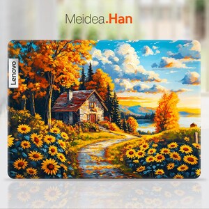 May include: A colorful painting of a small house with a red roof in a forest setting. The house is surrounded by trees with yellow and orange leaves. There are sunflowers in the foreground and a blue lake in the background. The text "Meidea.Han" is at the top of the image.