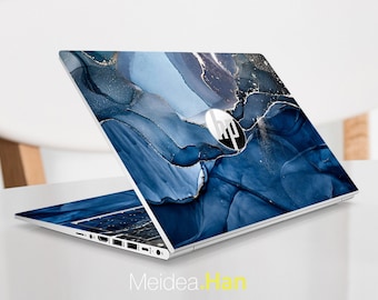 May include: A laptop computer with a blue and gold marble design on the lid. The HP logo is visible on the lid.