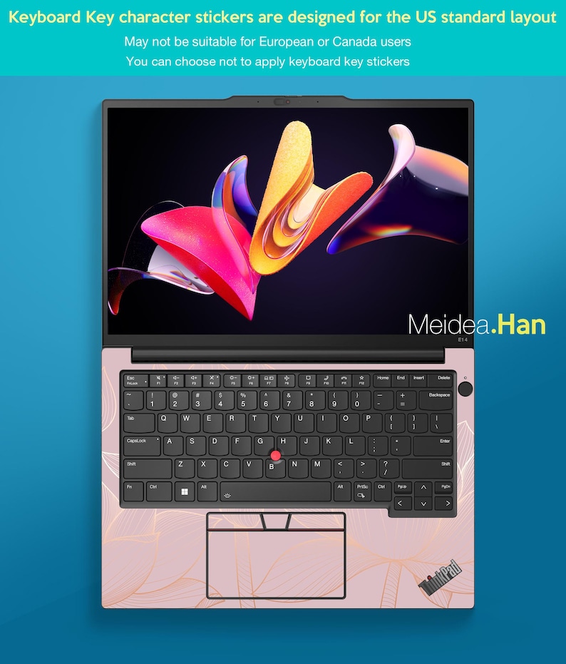 May include: A pink laptop with a black keyboard and a colorful abstract design on the screen. The keyboard has a US standard layout. The laptop's surface has a gold floral pattern. The text "Meidea.Han" is visible on the screen.