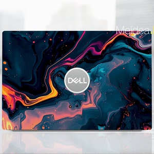 Peut inclure: Un ordinateur portable avec un design abstrait noir, bleu, orange et rose. Le logo Dell est visible sur l'ordinateur portable.