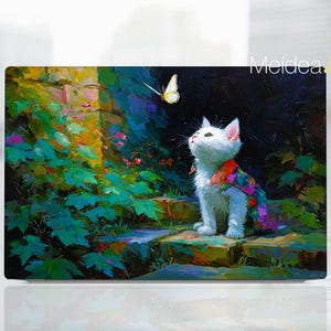 May include: A white cat with a colorful patterned shawl looks up at a yellow butterfly. The cat is sitting on a stone step in a garden setting, with lush green foliage and a brick wall in the background. The artwork is signed "Meidea Han".