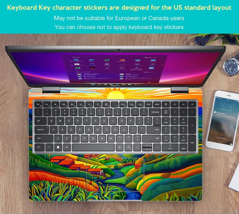 May include: A laptop computer with a colourful landscape design keyboard sticker. The sticker features a green river, yellow hills, and green trees. The laptop screen is on and shows a desktop with multiple icons. The text on the sticker reads "Keyboard Key character stickers are designed for the US standard layout. May not be suitable for European or Canada users. You can choose not to apply keyboard key stickers."