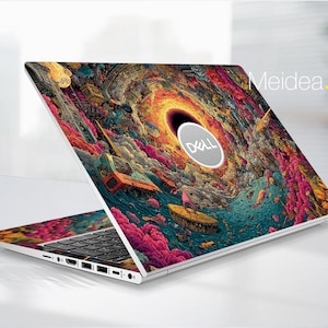 May include: A Dell laptop with a vibrant, colorful skin featuring an abstract design with swirling patterns in shades of orange, blue, pink, and yellow. The Dell logo is visible on the laptop's lid. The text "Meidea.Han" is visible on the right side of the laptop.