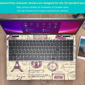 May include: A laptop computer with a keyboard sticker featuring a vintage Parisian theme. The sticker has a beige background with brown and purple stamps and a drawing of the Eiffel Tower. The text on the sticker reads "Q, W, E, R, T, Y, U, I, O, P, A, S, D, F, G, H, J, K, L, Z, X, C, V, B, N, M, Oilyuka, CIRATH, BURY DEIREXEY-4, FORUS".