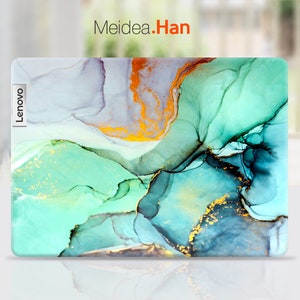 May include: A laptop skin with an abstract design featuring swirling blue, green, and gold colors. The skin has the word "Lenovo" printed on the side.