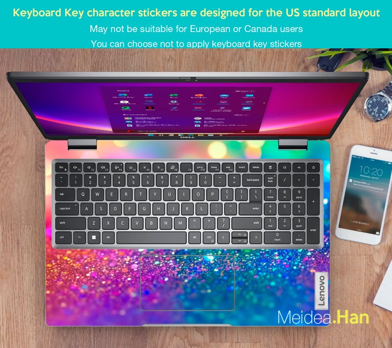 May include: A silver laptop computer with a colorful glitter keyboard sticker. The sticker features a gradient of pink, purple, blue, and green colors. The laptop is open and the screen is displaying a desktop with multiple icons. The text "Lenovo" is visible on the right side of the laptop. The text "Meidea.Han" is visible at the bottom of the image.
