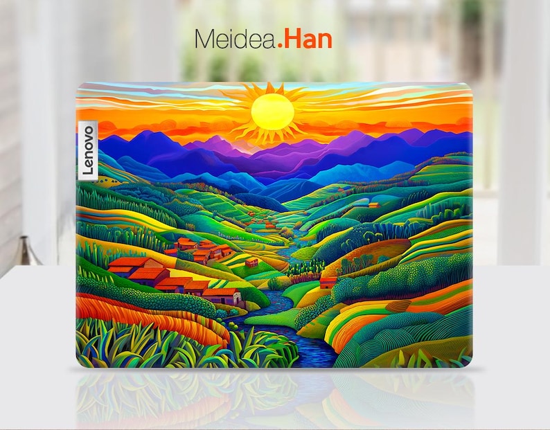 May include: A colourful laptop skin featuring a landscape scene of mountains, a river, and a sunset. The skin has a bright yellow sun, green hills, and a blue river. The text "Lenovo" is visible on the left side of the skin.