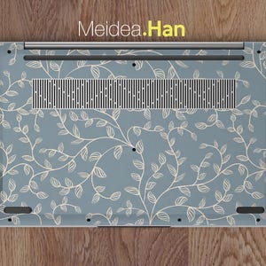 May include: A laptop skin featuring a light blue background with a repeating pattern of cream-colored vines and leaves. The skin has a rectangular shape with a vent and port cutouts. The text "Meidea.Han" is visible at the top.