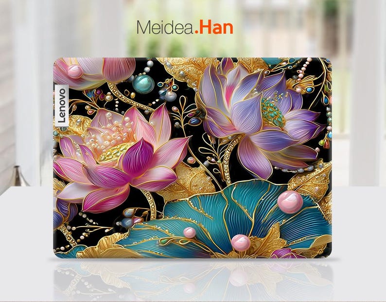May include: A Lenovo laptop case featuring a vibrant floral design. The case showcases large, detailed lotus flowers in shades of pink and purple, accented with gold leaves and teal accents against a black background. The text "Meidea.Han" is visible.