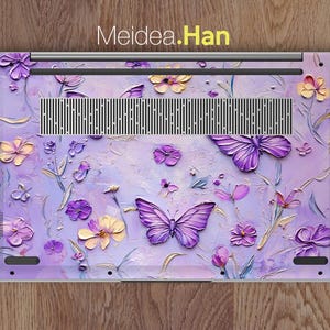 May include: Purple and yellow floral design laptop skin with butterflies. Meidea.Han.