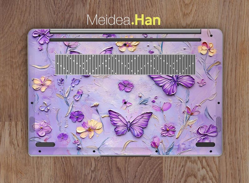 May include: Purple and yellow floral design laptop skin with butterflies. Meidea.Han.