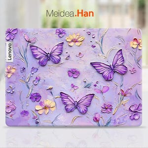 May include: Purple laptop skin with a floral design featuring butterflies and flowers. The text "Meidea.Han" is printed on the skin.