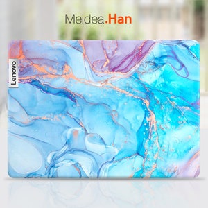 May include: A blue and purple laptop skin with a marbled design and gold accents. The skin has the word "Lenovo" printed on the left side.