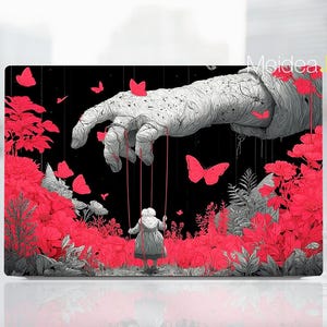 May include: A black and red art print featuring a large hand manipulating a small figure with strings. Red butterflies and flowers are scattered throughout the scene. The artwork has a surreal and dreamlike quality.