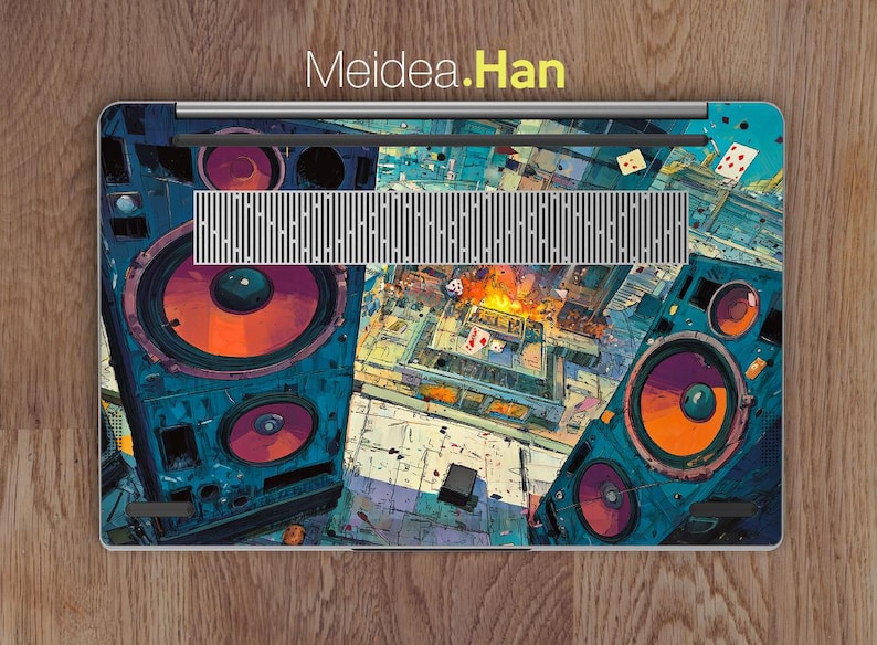 May include: Laptop skin with a colourful, abstract design of a boombox featuring large orange speakers and a cityscape. The design incorporates shades of blue, orange, and purple, with the text "Meidea.Han" at the top.