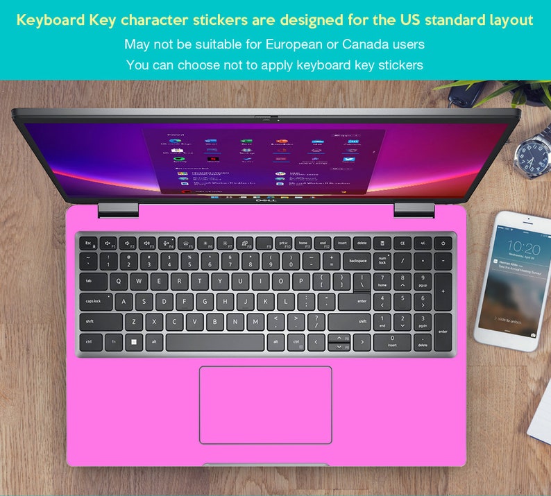 May include: A pink laptop computer with a silver keyboard and a touchpad. The laptop is on a wooden surface. The text on the screen reads "Keyboard Key character stickers are designed for the US standard layout. May not be suitable for European or Canada users. You can choose not to apply keyboard key stickers."