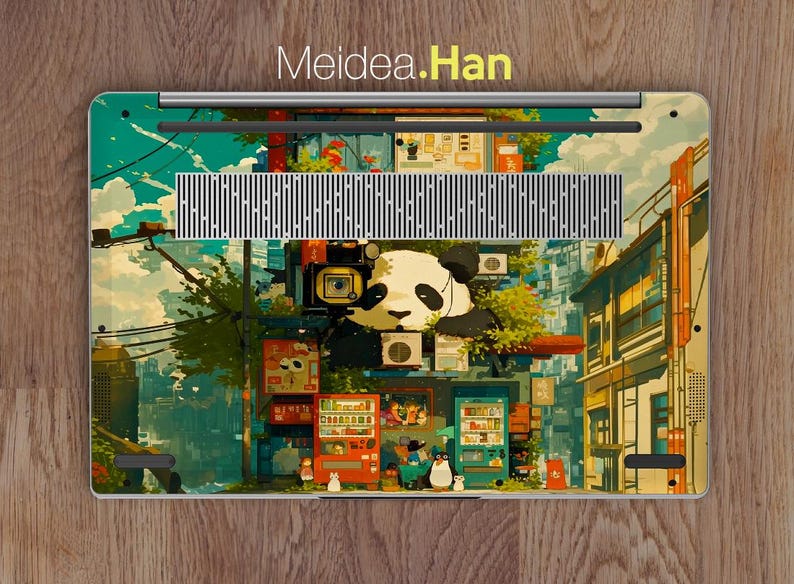 K&ouml;nnte beinhalten: Eine farbenfrohe Laptop-Haut mit einem Panda, der eine Kamera tr&auml;gt, einer Stadtlandschaft und dem Text "Meidea.Han".