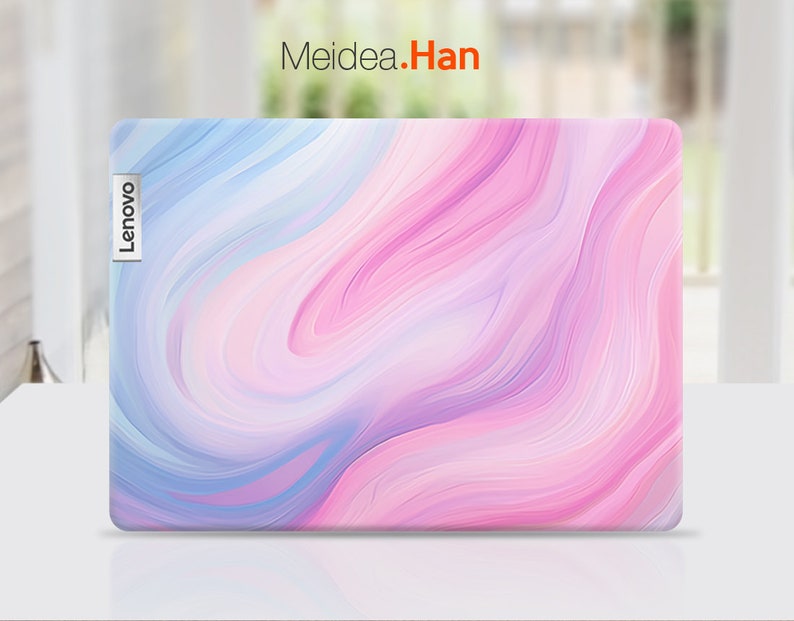 May include: A pink and blue laptop skin with a swirling marble pattern. The skin has the word "Lenovo" printed on the left side.