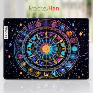 May include: A black laptop skin with a colorful, intricate design of a celestial compass with stars and planets on a dark blue background. The text "Meidea.Han" is at the top of the skin. The Lenovo logo is on the left side of the skin.