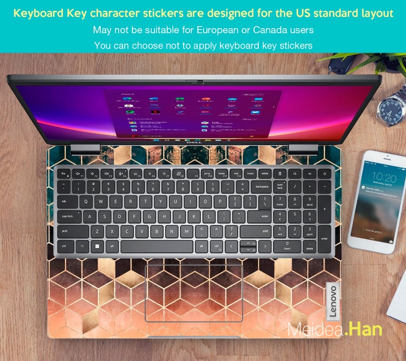 May include: A laptop computer with a geometric pattern keyboard sticker. The sticker features a hexagonal pattern with gold and orange accents. The laptop screen is displaying a desktop with multiple icons. The text "Lenovo" is visible on the bottom right corner of the laptop. The text "Meidea.Han" is visible on the bottom right corner of the image.