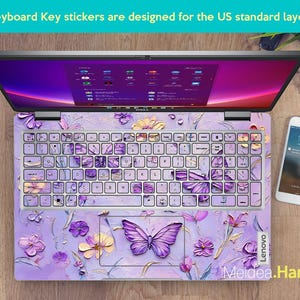 May include: Purple and white keyboard stickers with a butterfly design. The stickers are designed for a US standard keyboard layout. The stickers are shown on a laptop keyboard.