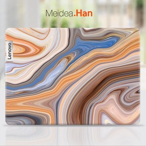 May include: A laptop skin with a swirling abstract pattern in shades of brown, orange, blue, and gray. The skin has the word "Lenovo" printed on the side.
