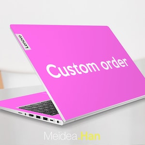 May include: A pink laptop with a white "Custom order" sticker on the lid. The laptop is open and the screen is facing away from the camera. The Lenovo logo is visible on the left side of the lid.
