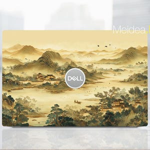 May include: A laptop skin featuring a landscape painting with mountains, water, and buildings in shades of yellow, brown, and green. The Dell logo is centered. The text "Meidea Han" is in the upper right corner.