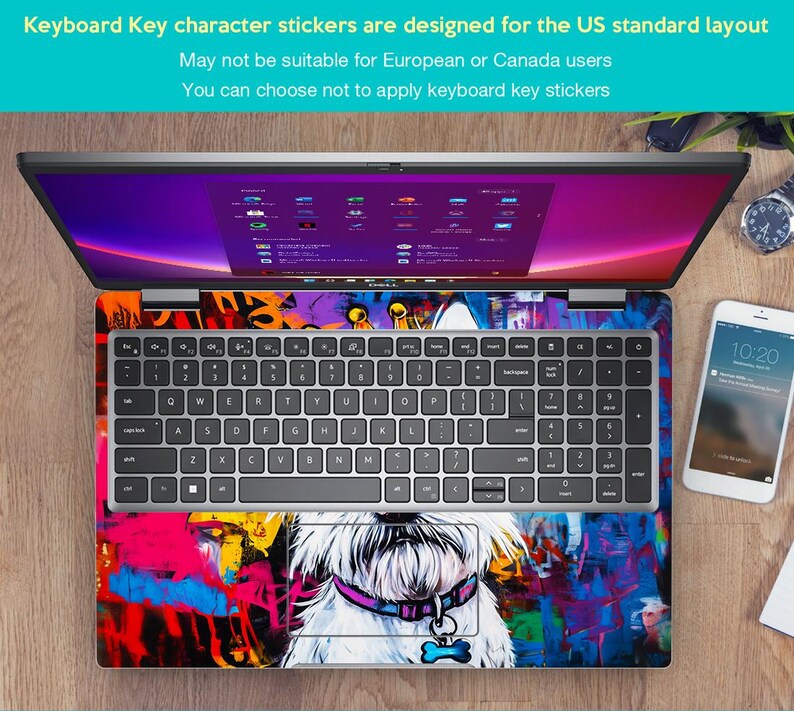 May include: A laptop computer with a colourful graffiti design sticker on the keyboard and touchpad. The sticker features a white dog with a pink collar and a bone charm. The laptop is open and the screen is displaying a desktop with multiple icons.
