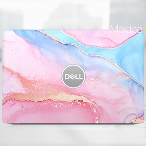 May include: A pink, blue, and gold laptop skin with a marble-like design. The Dell logo is in the center of the skin.