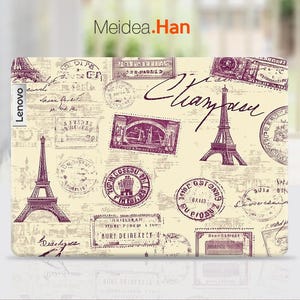 May include: A laptop skin with a vintage Parisian theme. The design features a repeating pattern of stamps, Eiffel Tower, and the word "Champagne". The skin is beige with purple accents.